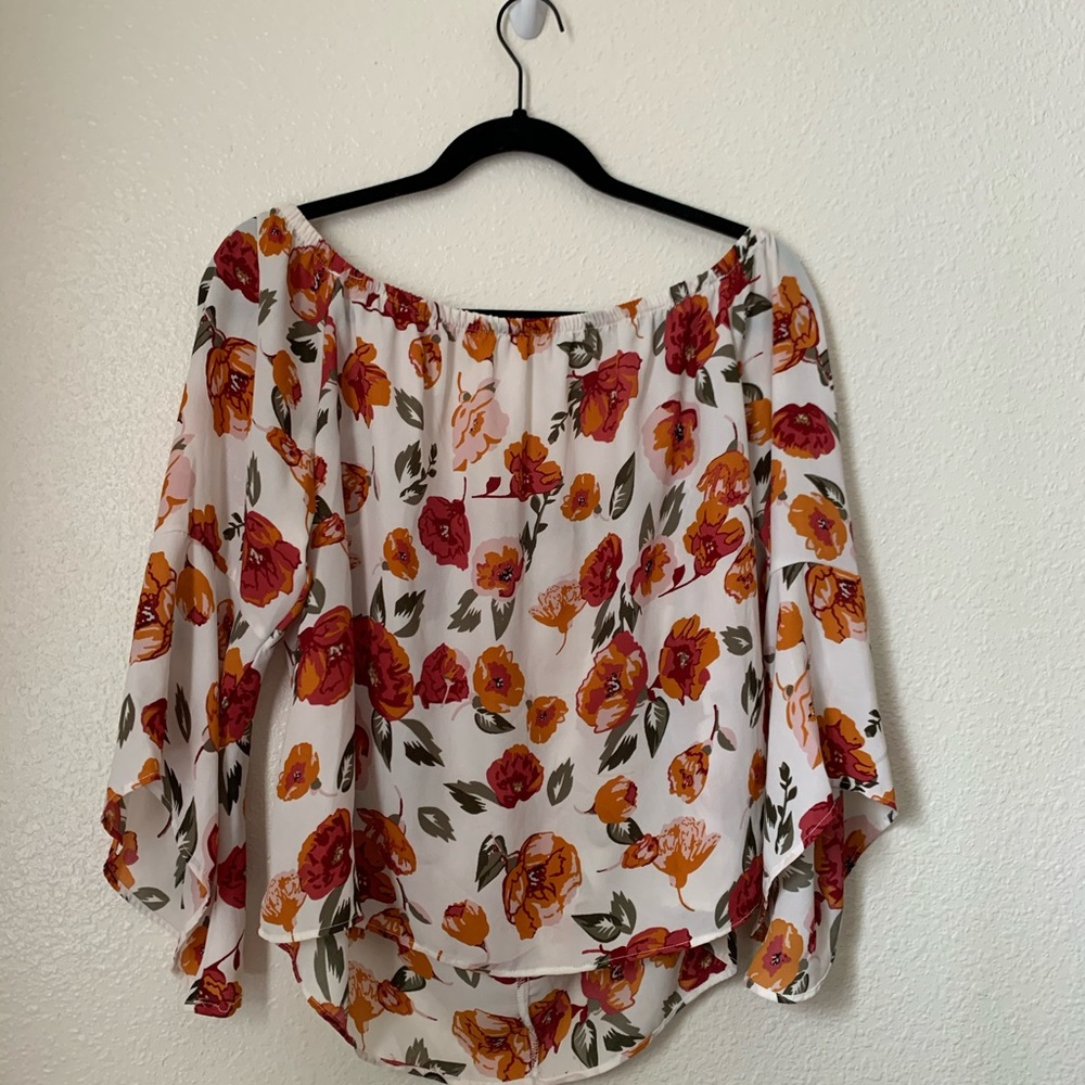orange and pink flowy, off the shoulder blouse